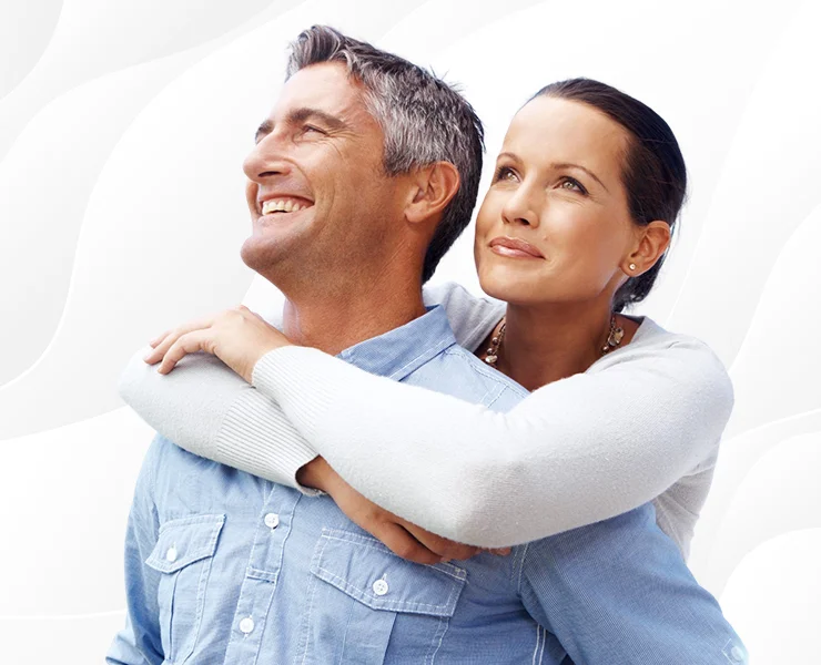 Middle aged couple smiling and embracing each other | Regenerative Medicine | Interventional Spine and Pain Associates